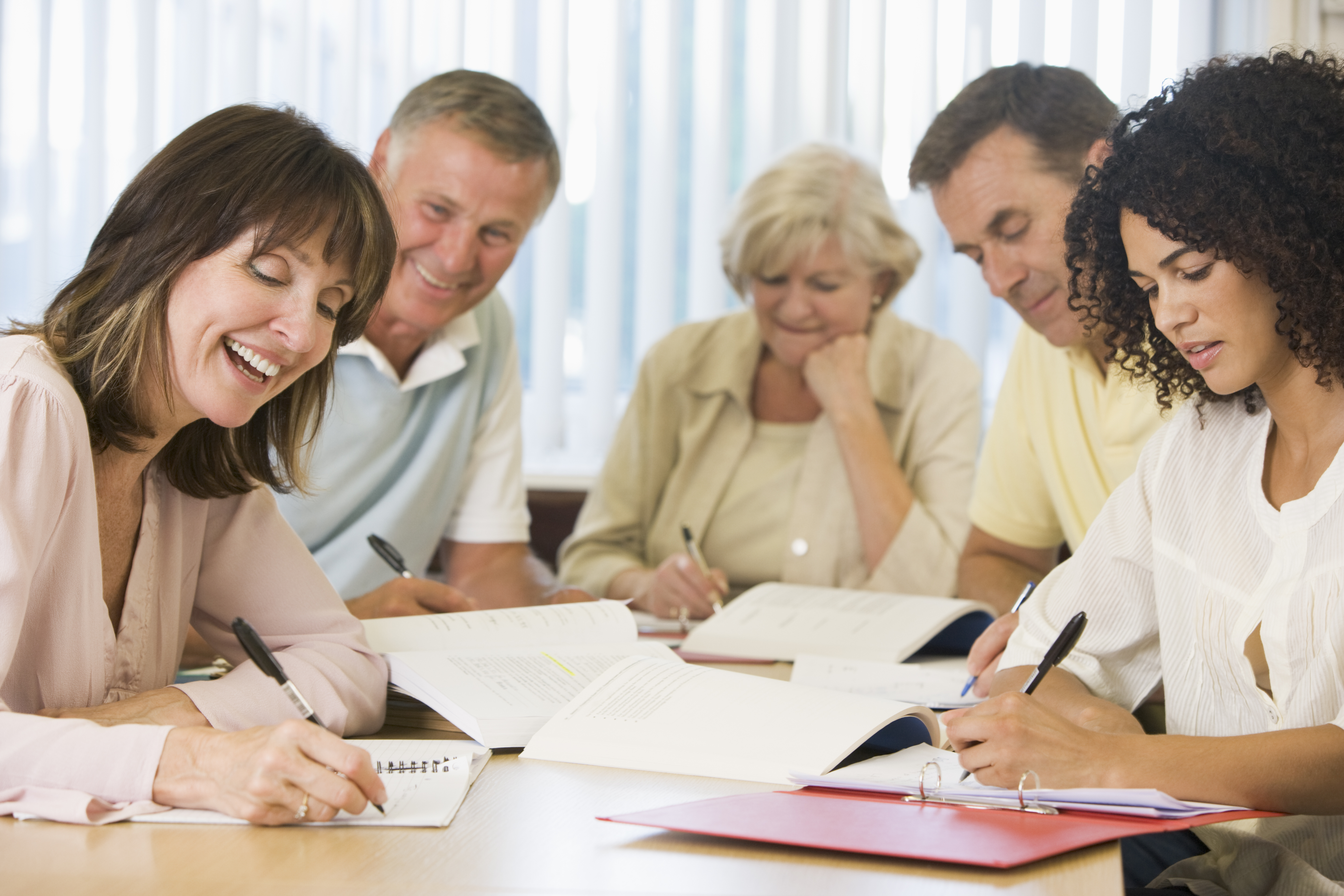 shutterstock_15258847_adults writing together